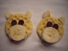 two waffles with faces made to look like a giraffe