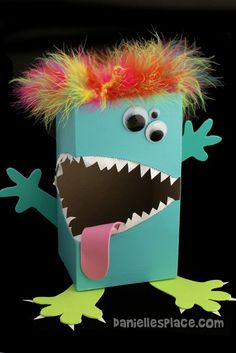 a box with a monster's head sticking out of it and the words monster valentine box