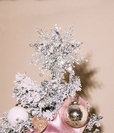 a small christmas tree with ornaments on it