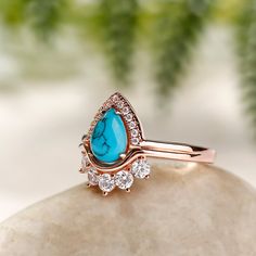 Turquoise is perhaps the oldest stone in man's history. Turquoise has spanned all cultures, prized as a symbol of wisdom, nobility and the power of immortality. A breathtaking pear-shaped turquoise sparkles at the center of this beautiful engagement ring and shines even brighter with a stunning pear-shaped halo surround. This ring is decorated with a turquoise stone for a mysterious and exquisite look. It will bring you wealth and happiness.Carat Weight: 0.5 ctStone Size: 6*8 mmStone Type: Jeuli Spiritual Turquoise Ring For Anniversary, Southwestern Teardrop Turquoise Gemstone Ring, Turquoise Art Deco Rings For Gift, Exquisite Pear-shaped Gemstone Ring, Vintage Chrysocolla Turquoise Ring, Vintage Multi-stone Turquoise Ring Gift, Symbol Of Wisdom, Beautiful Engagement Rings, Old Stone