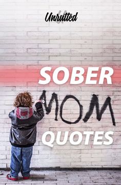 a little boy writing on the wall that says, sobber mom quotes with spray paint