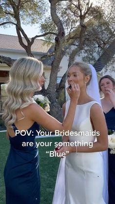 two bridesmaids are talking to each other in front of a tree with the caption pov your bridesmaids are your something blue