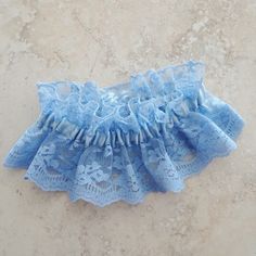 "Wonderful shower gift for the bride. Something blue to go with her wedding ensemble. The garter is made in a vintage corn silk blue lace and gathered with an elastic casing of matching blue satin ribbon. This is a classic design for a garter. This particular garter is 14\" stretching to 21\"." Bride Something Blue, Something Blue For Bride, Corn Silk, Elastic Casing, Wedding Garter Lace, Blue Garter, Lace Choker Necklace, Fabric Earrings, Lace Garter