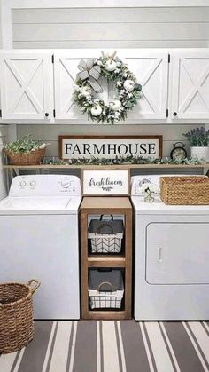 a white washer and dryer sitting next to each other in a laundry room