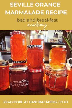 several jars filled with orange marmalade sitting on top of a table