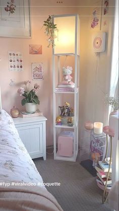 a bedroom with a bed, nightstand and shelves in the corner that have flowers on them