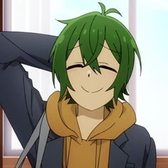 an anime character with green hair wearing a brown hoodie and holding his hands behind his head