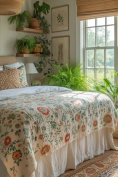 a bed sitting in a bedroom next to a window with plants on the windowsill