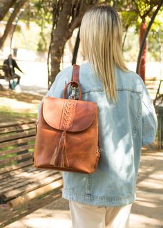 Backpack leather for women in brown color. This racksuck purse has one unified space inside with a zipped pocket. We love the cross stich in the front of the bag, a perfect hand crafted accessory for a woman, a life time leather bag made by using chemical-free natural tan leather. All of our products are handmade with the best and highest quality leather from our beloved island of ''Crete''.  The leather used for each item may be irregular in terms of colour and texture due to its natural characteristics SIZE GIDE SMALL Height 22 cm / 8.66 inches Length 18cm / 7.08 inches Width 12cm / 4.72 inches MEDIUM Height 27cm / 10.63 inches Length 21cm / 8.26 inches Width 15cm / 5.9 inches LARGE Height 33cm / 12.99 inches Length 27cm / 10.62 inches Width 18cm / 7.08 inches Model size Height: 172 cm Brown Leather Backpack For On-the-go, Handmade Leather Backpack, Women's Backpack, Leather Backpack Purse, Leather Rucksack, Women Leather Backpack, Boho Leather, Handcrafted Accessories, French Women