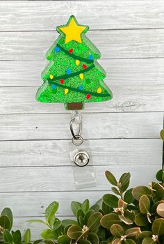 "This is a cute Christmas Tree badge reel charm.  Features sparkly green glitter. Each charm is 2\" and comes with a retractable badge reel. Check out all of our badge reel charms and find one to suit the occasion! Our acrylics have a 30-day guarantee from defect starting on the date you receive your purchase.  Please contact us if you have any issues and we'll be happy to fix it.  We do not manufacture the badge reels.  If you would like your acrylic to be fastened to the badge reel with Velcro Personalized Green Badge Holders As Gift, Christmas Badge, Epoxy Crafts, Cute Christmas Tree, Acrylic Keychains, Retractable Badge Reel, Green Glitter, Aesthetic Collage, Cute Christmas