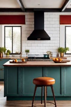 Modern kitchen with teal cabinets, a wooden island, and black range hood against white subway tiles. Floorboards Kitchen, Trendy Kitchen Decor, Colorful Kitchens