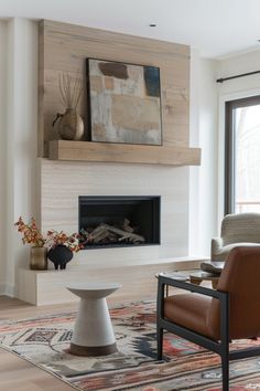 a living room with a fire place, chair and rug in front of the fireplace