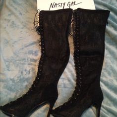 These Black Thigh-High Heels Feature Black Lace, Lace-Up Detailing At Front, An Open Toe, And Stiletto Heel. Zip Closure At Back, Partially Lined. Cushioned Insole. Pair Them With A Structured Shift Dress Or Your Favorite Pair Of Jeans. Fall Party Lace-up Knee-high Boots, Edgy Fitted Knee-high Boots, Fitted Edgy Knee-high Boots, Fitted Lace-up Knee-high Boots For Spring, Fitted Pointed Toe Knee-high Boots For Night Out, Edgy Knee-high Party Heels, Fitted Knee-high Heeled Boots For Evening, Thigh High Heels For Club, Fitted Thigh High Club Heels