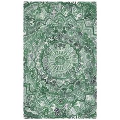 a green and white rug with an intricate design