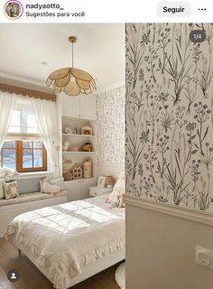 a bedroom with white walls and floral wallpaper on the walls next to a bed