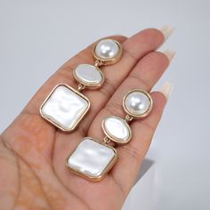 New to our Millennium collection. This beautiful Earring handmade with fine quality of Faux Pearls and beautifully made Fine quality of Metal for your special day. Even we have hard time taking pictures because of their shine 😄 so we want to shine our brides on their special days. The material used in these Earring are free from Lead, Nickel, Cadmium so it will not give you any skin irritation and environment friendly too.. The Earring Measures About 2.25 Inches Long and 0.8 Inches Wide ► ABOUT Elegant White Alloy Jewelry, Elegant Alloy Earrings As Gift, Elegant Alloy Earrings For Gift, Elegant Alloy Clip-on Earrings For Party, Handmade Elegant Alloy Earrings, Elegant Alloy Earrings For Wedding, Elegant Wedding Earrings Made Of Alloy, White Alloy Jewelry For Anniversary, White Alloy Pierced Earrings