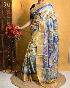 Hand Paint Kalamkari Work Zari Boder On Tassar Silk With Blouse Piece Bishnupuri Tassor Silk Saree, Gift For Her, Saree For Traditional Wear Step into elegance with our stunning saree featuring a perfect blend of multi-colored floral motifs on a serene blue backdrop, accentuated by cream borders and Zari embellishments. The intricate Kalamkari artwork, meticulously handcrafted using the pen technique, adds a touch of sophistication and traditional Indian charm to each design. Our skilled artisans pour their heart into each piece, ensuring that every saree tells a unique story of artistic brilliance and uncompromising quality. While some may take extra time to complete, rest assured that the result is always worth the wait--a true masterpiece that captures the essence of originality. Feel t Multicolor Tussar Silk Sets For Wedding, Multicolor Meenakari Raw Silk Sets, Multicolor Traditional Wear With Pallu In Art Silk, Multicolor Art Silk Traditional Wear With Pallu, Multicolor Cutdana Traditional Wear For Puja, Multicolor Traditional Wear For Puja With Cutdana, Multicolor Saree With Cutdana, Multicolor Traditional Wear With Cutdana For Puja, Multicolor Slub Silk Sets For Wedding