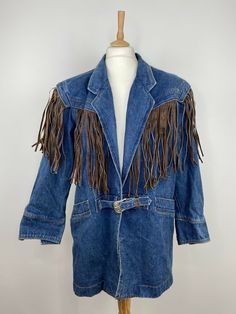 Some stains (please see pictures before purchase) Vintage 80s Denim Fringe Western Oversized Jacket Coat Leather Trim - Size M. Shipped with USPS Priority Mail. MEASUREMENTS Please see photos above for all measurements. POLICY If you have any questions about this item, please contact us.  Your order will be processed and have a tracking number within 1 working day of receiving payment (Monday-Friday) Any order placed before 2PM Eastern Standard Time will ship the same day In the very unlikely ev Retro Medium Wash Outerwear For Fall, Medium Wash Outerwear For Rodeo In Fall, Spring Western Denim Outerwear, Western Style Medium Wash Outerwear For Spring, Vintage Medium Wash Denim Jacket For Rodeo, 80s Fringe, Denim Fringe, 80s Denim, 1990s Fashion