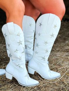 White Western Boots With Stars These white cowgirl boots will leave your audience positively starstruck!These vegan leather western boots feature a pointed toe, a short heel, and sparkling silver stars throughout! You're sure to cherish these boots for years to come. Premium Vegan Leather Reusable Tote Bags Wooden Bottoms Plush Lining Calf fits up to a 17" calf. Toe: SNIPShaft: 16"Heel: 2" Boots With Stars, Wester Wear, White Western Boots, Wide Calf Cowgirl Boots, White Cowgirl Boots, Cowgirl Boots Outfit, Southern Boutique, Star Boots, Short Heels