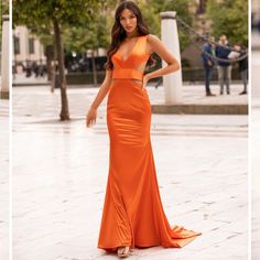 Beautiful Unique Orange Gown! This Is A Made To Order Item. I Planned On Wearing It To A Black Tie Wedding But Went With A Tuxedo Look Instead. Tags Removed But Outside Of Trying It On, It Has Never Been Worn. Sizing Is Tricky- It Is An Xs But My Measurements Are 38 Bust, 27 Waist, 36 Hip With 36d Bra And This Fits Me, The Bust Strap Is A Bit Tight But As You Can See From The Photos Everything Else Looks Perfect. I’m Normally A Small. The Material Is A Thick Stretchy Satin, Very Flattering. I’m 5’8” And As You Can See It Has A Train- I’m Wearing A 2 Inch Heel For The Pics. From An Australian Brand- If You Need A Gown And Don’t Want To Get The Same One Everyone Is Getting From Satin Mermaid Gown, Orange Gown, Alamour The Label, Orange Satin, Black Tie Wedding, Dreamy Dress, Satin Gown, Mermaid Gown, Foto Pose