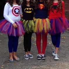 three girls dressed up in costumes for halloween