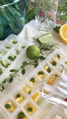 there are lemons, limes and other food items on the table with utensils