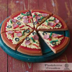 a small pizza sitting on top of a blue plate