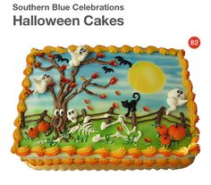 a cake decorated to look like a halloween scene with cats, bats and pumpkins