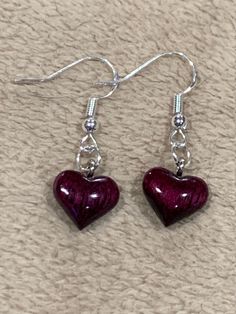 Beautiful heart earrings are carved out of purpleheart wood. Purpleheart wood can vary greatly in its appearances, from colors that vary from reds or pinks that can show lots of wood grain to deep purple or maroon's like what we have selected for these earrings. The deep, rich color of this wood is so beautiful that I could not help but create these earrings (and the matching necklace also available) without any accents or other wood combined. It is hand shaped, hand dipped in resin and hand pol Diy Jewelry Earrings, Funky Earrings, Purple Earrings, Bling Bling, Funky Jewelry, Wood Earrings, Matching Necklaces, Cute Earrings, Heart Earrings