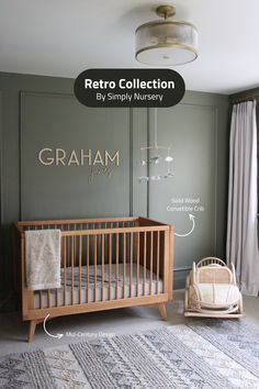 a baby's room with gray walls and furniture