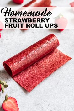 homemade strawberry fruit roll ups with strawberries on the side and text overlay that reads homemade strawberry fruit roll ups