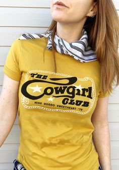 The Cowgirl Club Tee by kaeraz / womens graphic tees / vintage style 70s southwest t shirt / cowgirl arizona desert country gifts souvenir t-shirt Retro Rodeo T-shirt With Screen Print, Retro Rodeo Crew Neck T-shirt, Retro Crew Neck T-shirt For Rodeo, Retro Style Crew Neck T-shirt For Rodeo, Retro Screen Print Tops For Rodeo, Retro Letter Print Tops For Rodeo, Vintage Tops For Western-themed Events, Vintage Short Sleeve T-shirt For Western-themed Events, Vintage T-shirt For Western-themed Summer Events