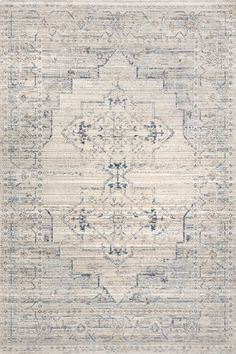 a beige and blue rug with an intricate design