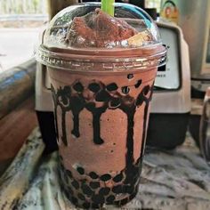 there is a drink with chocolate and ice cream in it