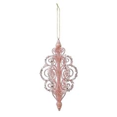 a pink glass ornament hanging from a string