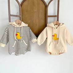 Quack up your little one's style with our Duckie Hoodie Romper! This adorable ensemble combines the cuteness of a romper with the coziness of a hoodie. Made from soft and comfy fabric, it features charming duckie prints that add a playful touch to their outfit. The hoodie design keeps your baby warm and snug, while the convenient snap closures make dressing and changing a breeze. ﻿ Material: Cotton. Color: Stripped, Beige. Hoodie Romper, Spring Rompers, Neutral Baby Clothes, Long Sleeve Outfits, Baby Unisex, Baby Hoodie, One Piece Outfit, Baby Cartoon