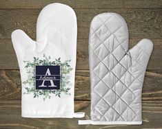 an oven mitt with the letter a on it next to a pair of oven mitts