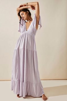 Forever free and flowy, this effortless maxi dress from our free-est collection is featured in a V-neck, tiered silhouette with flutter sleeves for added shape. * Soft, textured fabrication * Elastic empire waist * Effortless, pull-on style | La La Maxi Dress by free-est at Free People in Purple, Size: M Maternity Shoot Dress, Mermaid Cottage, Cottage Core Clothing, Caribbean Outfits, Maternity Street Style, Pretty Summer Dresses, Free People Maxi, Shower Dresses, Picture Outfits