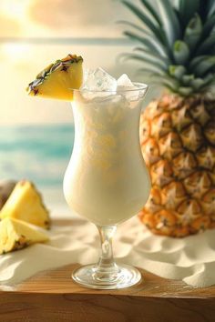 a pineapple drink is garnished with ice