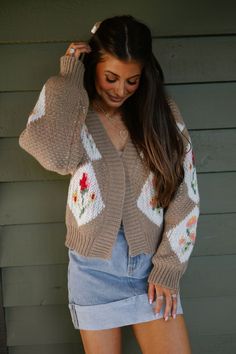 Wrap yourself in cozy warmth and elegant style with our Vintage Floral Bouquet Cardigan. Made with chunky knit for ultimate comfort, this cardigan also features intricate floral pattern details in a timeless taupe color. Perfect for adding a touch of vintage charm to any outfit. 100% polyester Model is 5'6" with a 35" bust, 26" waist, and 36" hips wearing a size small Bohemian Floral Print Winter Cardigan, Fall Vintage Floral Print Cardigan, Vintage Floral Print Cardigan For Fall, Winter Floral Print Knit Cardigan, Vintage Brown Cardigan For Spring, Vintage Chunky Knit Cardigan For Fall, Vintage Floral Print Winter Cardigan, Vintage Floral Print Cardigan For Winter, Vintage Winter Floral Cardigan