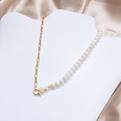 Our fine Mother of Pearl Necklace with gold-filled chain is a graceful and elegant piece that seamlessly blends sophistication with a touch of sparkle. This necklace features lustrous half mother of pearl complemented by a half fine gold-filled chain. The front hook, adorned with a glistening rhinestone, not only adds a hint of glamour but also serves as a stylish closure. The delicate design ensures that this necklace can effortlessly elevate both casual and formal ensembles. The combination of the luminescent mother of pearl and the warm glow of the gold-filled chain creates a timeless and refined accessory. Embrace understated luxury with our Fine Mother of Pearl Necklace - a versatile piece that effortlessly enhances your natural beauty and adds a touch of sparkle to your neckline. Nec Pearl Stone, Gold Filled Necklace, Mother Of Pearl Necklace, Le Crochet, Delicate Design, Wedding Jewellery Necklace, Anniversary Wedding, Gold Filled Chain, Wedding Necklace