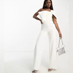 Turn Heads In This Ivory Wide-Leg Jumpsuit Designed In A Shoulder-Baring Silhouette With A Dramatic Neckline Bow. Strapless Zip Closure New With Tag White Strapless Jumpsuit For Spring Evenings, White Strapless Jumpsuit For Evening And Spring, White Strapless Jumpsuit For Summer Wedding, White Evening Pantsuit For Spring, White Summer Evening Pantsuit, Elegant White Strapless Jumpsuit, Spring White Overall Pantsuit, White Overall Pantsuit For Spring, White Spring Party Pantsuit