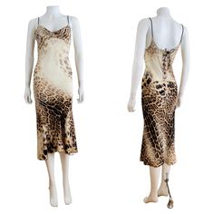 S/S 2002 Roberto Cavalli Dress Leopard animal print on silk Draped neckline Brown braided shoulder straps Slip style Midi length Low scooped upper back Braided corset detail up the back with copper snake head + tail finials Slips on overhead Lined on bust only Marked S, Measurements - Bust 16-17", Waist 13.5", Hips 16-17", Length 47" in front 50" in back /taken flat one side double where appropriate/ Excellent vintage condition, Clean + ready to wear All sales are FINAL so please do not hesitate Robert Cavalli Dress, Snake Clothing, Dress Lace Up Back, Robert Cavalli, 00s Style, Roberto Cavalli Dress, Cavalli Dress, Slip Midi Dress, Snake Head