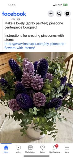 a vase filled with purple flowers on top of a table