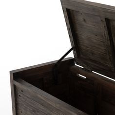 an open wooden box sitting on top of a table