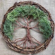 a wreath made out of twigs and moss