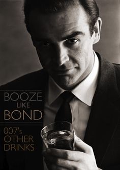 a man wearing a suit and tie holding a glass in his hand with the words booze like bond on it