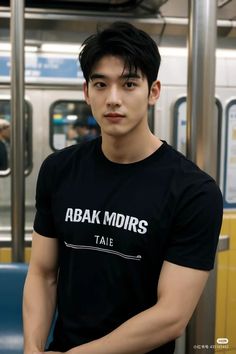 a young man standing on a subway train