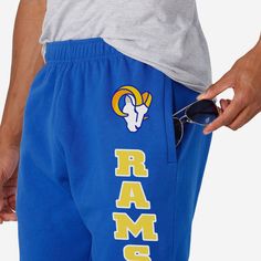 Show your true colors while crushing it in the gym or crushing a nap at home in these Los Angeles Rams Team Color Sweatpants. Features All-over, team-colored design so you can rep the team in style Team logo display on upper left leg, in case there were any doubts where your allegiances lie Vertical, stacked and team-colored team wordmark display on left leg so you can show off your team pride with every stride Elastic waistband to keep you comfortable Details Material: 65% Cotton/35% Polyester Crushing It, Logo Display, Los Angeles Rams, In The Gym, Stylish Shirt, Classic Pattern, Unisex Style, Stylish Shirts, Team Colors