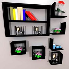 the shelves are filled with books, vases and other decorative items in black frames